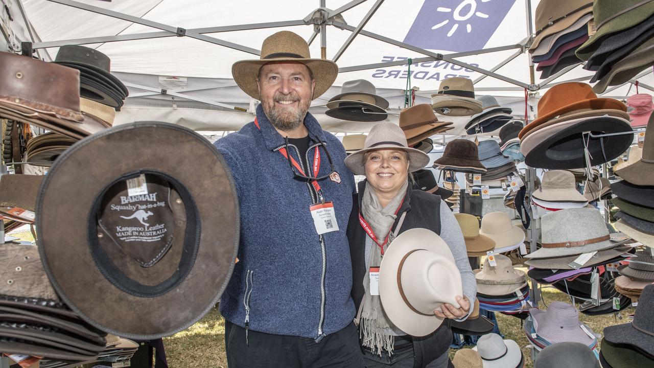 Alan and Anastasia Hansen of Sunsafe Traders with their hats at the Queensland Outdoor Adventure Expo, Toowoomba Showgrounds. Friday, July 29, 2022. Picture: Nev Madsen.