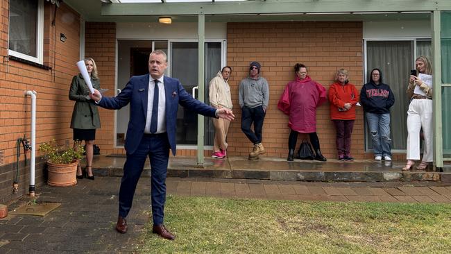 McGrath Geelong auctioneer David McGuiness and listing agent Egle Skridulis conduct an auction in Victoria, where Melbourne prices have risen for the first time in six months