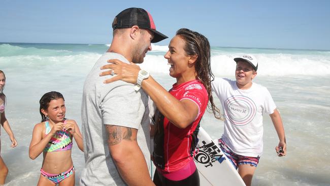Australia's Sally Fitzgibbons celebrates her victory with Trent Merrin after defeating Australia's Stephanie Gilmore in the final of the Surfest 2016 surfing competition at Merewether Beach in Newcastle. Pic Brett Costello