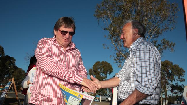 Labor candidate Dr Michael Freelander handing out how to vote cards for the marginal seat of Macarthur.