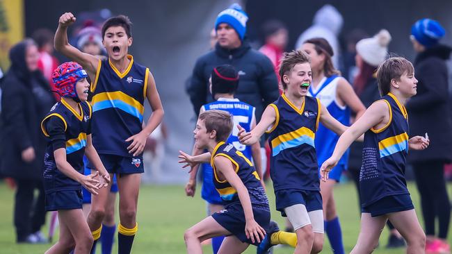 Southern Heights players James Foster, Eddie Whitehouse, Oliver Firgaira, Xavier Clancy and Max Grigg celebrate against Southern Valley at the Sapsasa Metro Football Carnival at Barratt Reserve, West Beach. Picture: Tom Huntley