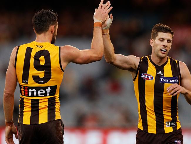 MELBOURNE, AUSTRALIA - APRIL 15:  Luke Breust of the Hawks and Jack Gunston of the Hawks celebrate a goal during the round four AFL match between the Hawthorn Hawks and the Melbourne Demons at Melbourne Cricket Ground on April 15, 2018 in Melbourne, Australia.  (Photo by Daniel Pockett/AFL Media/Getty Images)