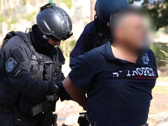 Police arrest the alleged cannabis grower in February 2014.