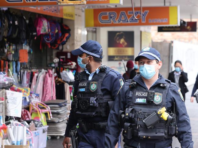 Police officers check Covid compliance in Fairfield City centre. Picture: NCA NewsWire / Damian Shaw