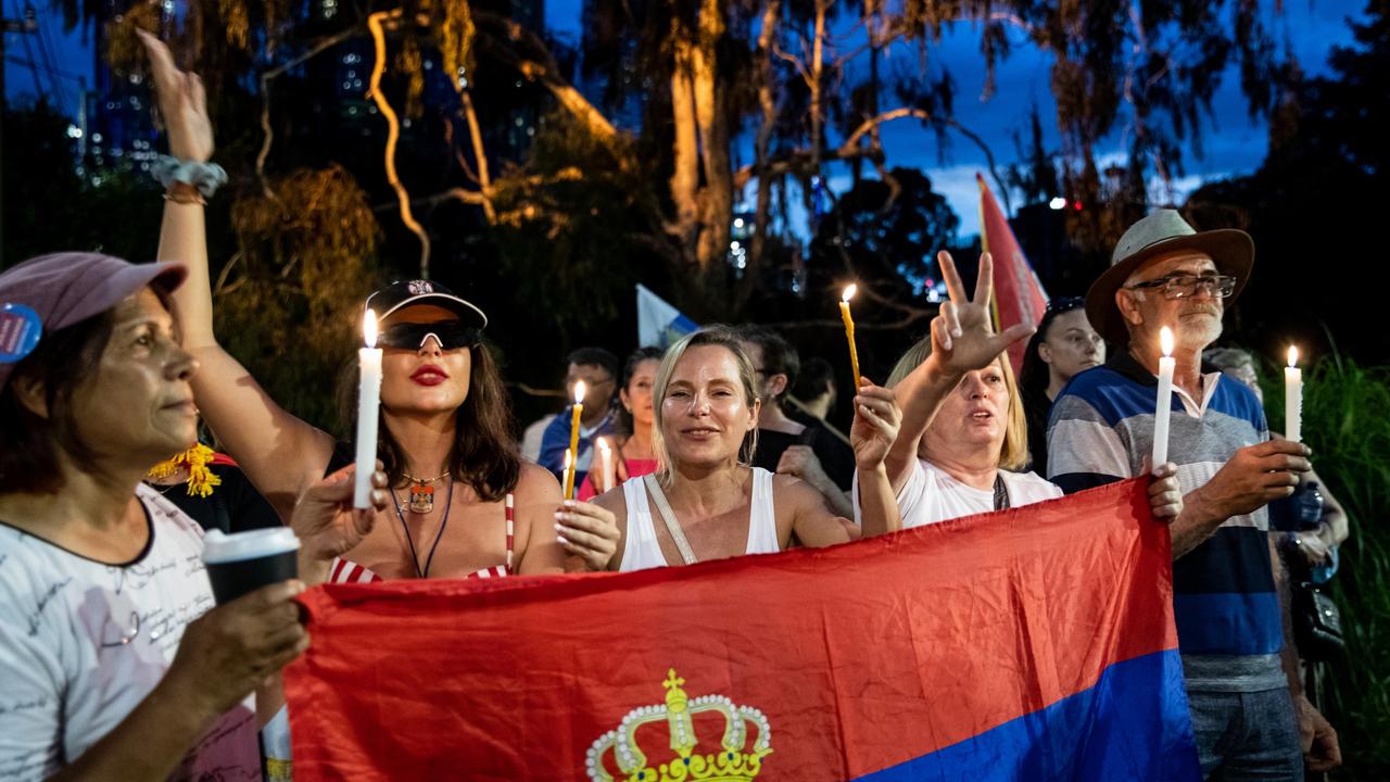 Djokovic supporters rally outside the Park Hotel where he was detained. (Photo by Diego Fedele/Getty Images)