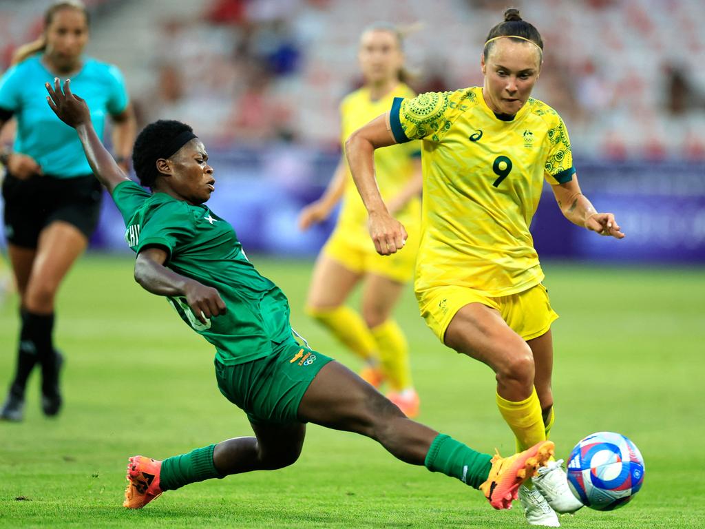 Caitlin Foord looks for a way past the Zambia defence. Picture: AFP