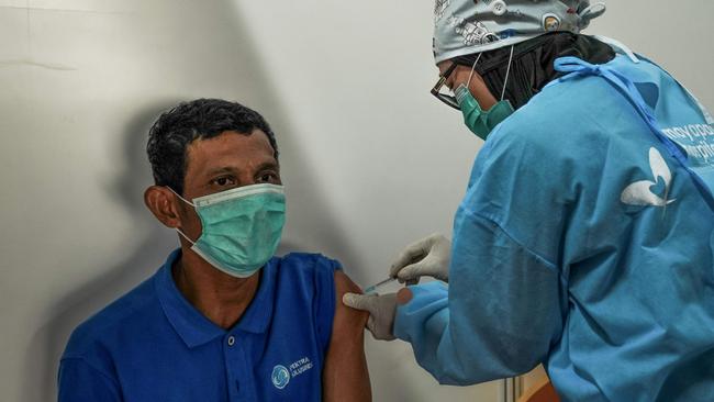 A Jakarta transport worker is vaccinated last week. Picture: AFP