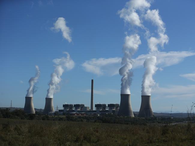 05/05/2023. Gerard Spinks, 59, Bayswater plant assistant manager, has worked in coal fired plants for more than four decades and is concerned about what will happen to workers as the economy detransitions. Photographed with  Bayswater Power station in the background, 15 minutes south of Muswellbrook in NSW. Britta Campion / The Australian