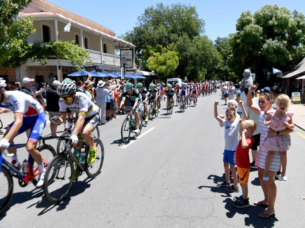 Crowds cheer on Peter Sagan as he passes with the peloton through Hahndorf. Christie Carr with Mitch and Judd Servaas, Noah Carr and Eden Carr. Picture: Tricia Watkinson