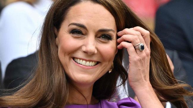 TOPSHOT - Britain's Catherine, Princess of Wales reacts as she arrives in the Royal Box on Centre Court to attend the men's singles final tennis match on the fourteenth day of the 2024 Wimbledon Championships at The All England Lawn Tennis and Croquet Club in Wimbledon, southwest London, on July 14, 2024. (Photo by ANDREJ ISAKOVIC / AFP) / RESTRICTED TO EDITORIAL USE