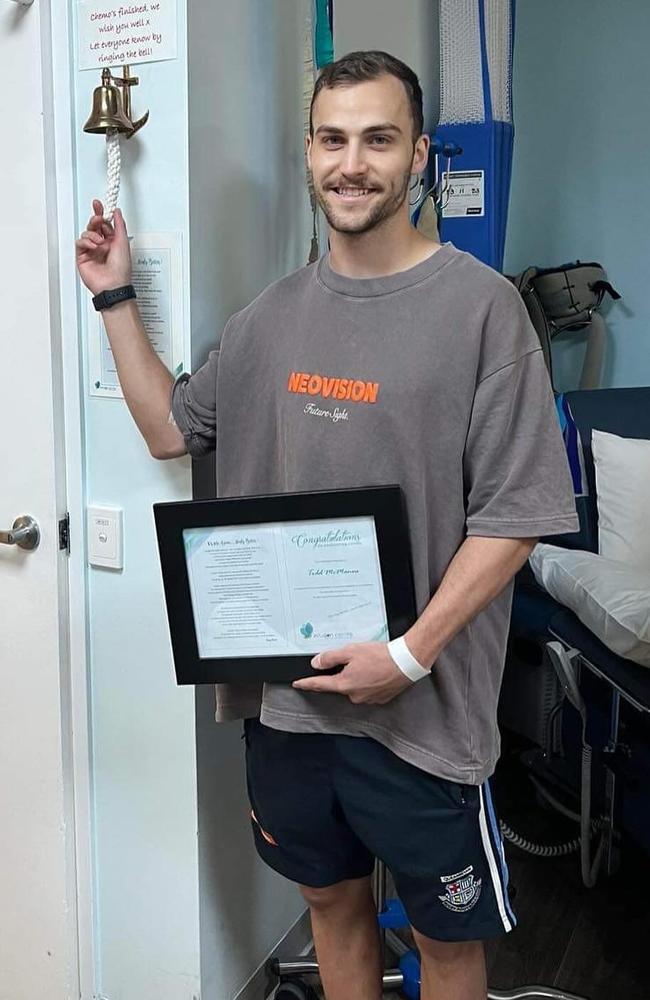 Todd McManus rings the bell following his last chemo treatment session.