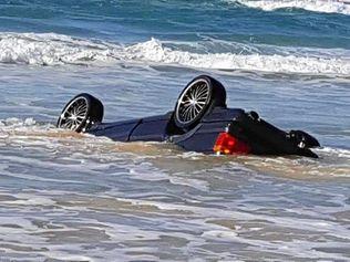 The high tide claimed a Range Rover on Fraser Island. These photos were posted to the I Got Bogged at Inskip Point Facebook page.