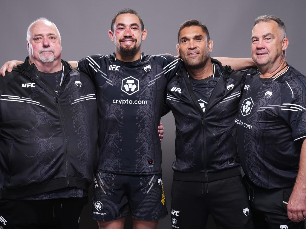 Team Reaper: Whittaker’s dad, Jack, Rob, Prates and boxing coach Brian Doyle. Picture: Mike Roach/Zuffa LLC via Getty Images