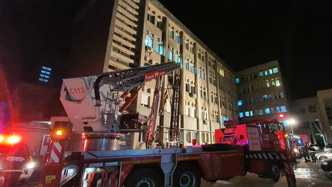 Emergency services workers respond to the fire at a hospital’s intensive care unit in Piatra Neamt city, Romania. Picture: AFP