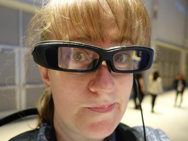 Test run ... on the head, the SmartEyeglass spectacles are heavier than typical glasses frames, with arms that sit wider than normal. Picture: Jennifer Dudley-Nicholson