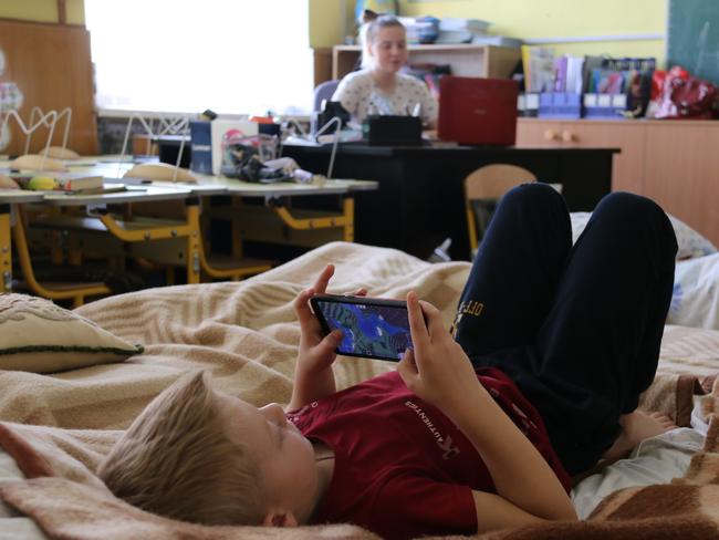 They all live in one classroom, surrounded by the blackboards and learning materials. Picture: Kimberley Gardiner.