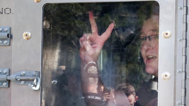 Young man detained by police, University of Queensland students protest against the uni's China-aligned Confucius Institute, St Lucia. Picture: Liam Kidston.