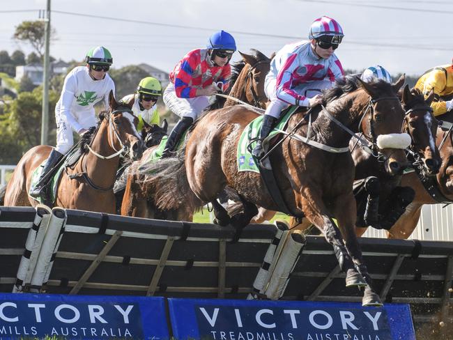 WARRNAMBOOL, AUSTRALIA - MAY 01: Luca Remondet riding Chains of Honour jumps hurdle on his way to win race 6, the Sovereign Resort Galleywood Hurdle during Galleywood Day at Warrnambool Racecourse on May 01, 2024 in Warrnambool, Australia. (Photo by Vince Caligiuri/Getty Images)