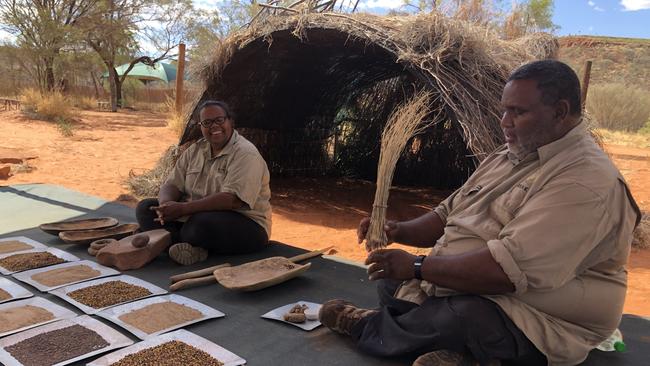 Peter and Natasha with dishes of native seeds. Picture: Victoria Laurie