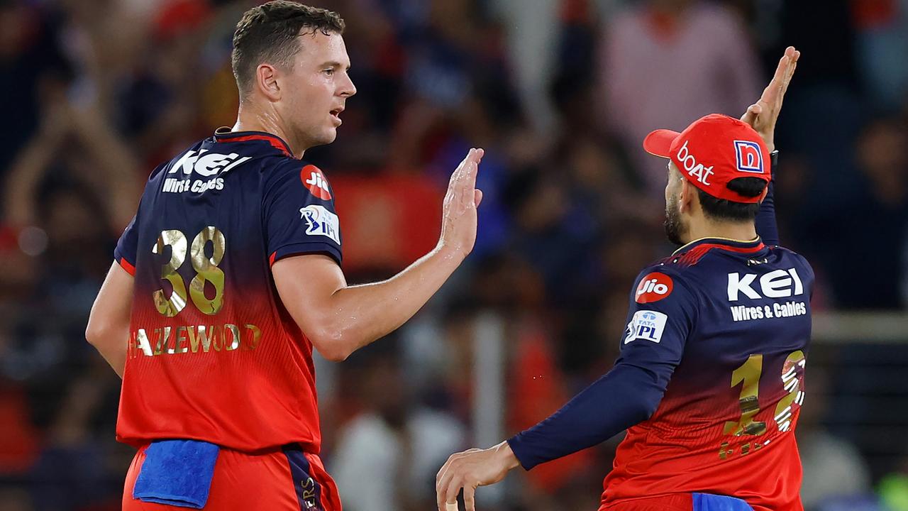 Josh Hazlewood of Royal Challengers Bengaluru celebrates with teammate Virat Kohli after dismissing Priyansh Arya of Punjab Kings during the 2025 IPL Final.