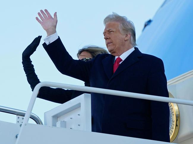 Former President Donald Trump and wife Melania Trump wave as they board Air Force One for the final time. Picture: AFP