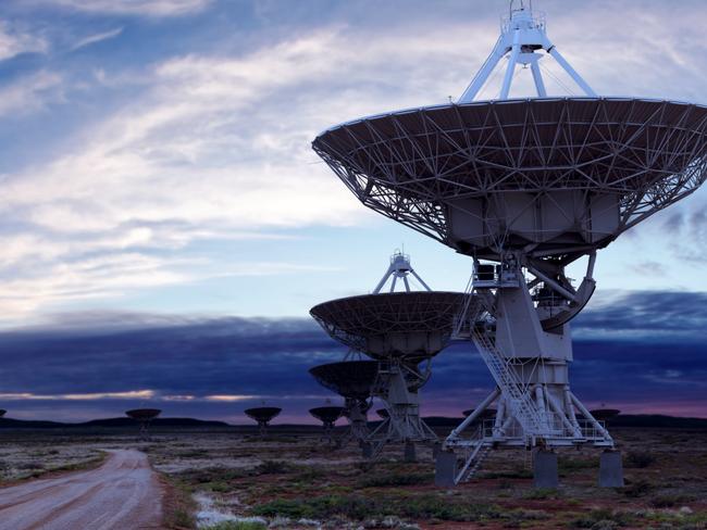 South Australia is poised to become one of the world's space industry capitals. Picture: iStock giant radio telescope satellite dishes at twilight, panoramic frame (XL)