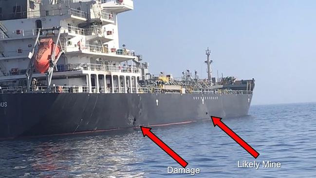 This June 13, 2019, image released by the U.S. military's Central Command, shows damage and a suspected mine on the Kokuka Courageous in the Gulf of Oman near the coast of Iran. The U.S. military on Friday, June 14, 2019, released a video it said showed Iran's Revolutionary Guard removing an unexploded limpet mine from one of the oil tankers targeted near the Strait of Hormuz, suggesting the Islamic Republic sought to remove evidence of its involvement from the scene. (U.S. Central Command via AP)