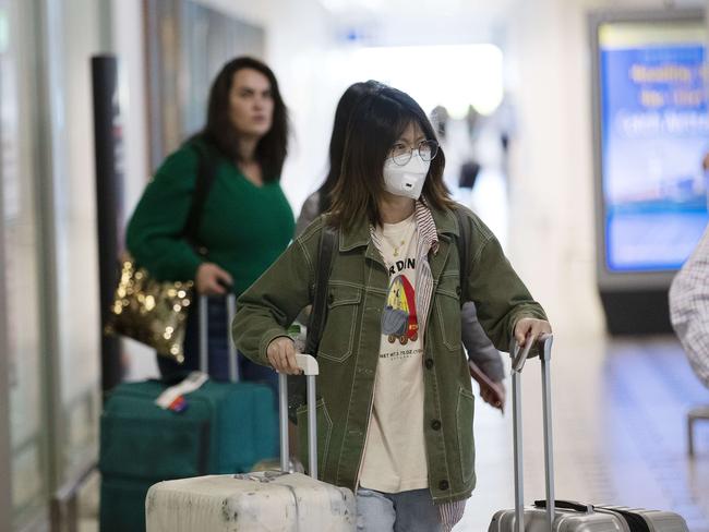 Travellers arrive at Brisbane International Airport, Brisbane on Sunday. Picture: A AP