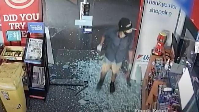 CCTV captured the man breaking into the Booval service station with a hammer.