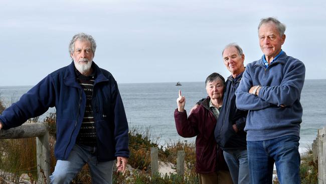 Residents David Catherwood, Patsy and Jim Fitzpatrick and Ratepayers Association Prepsident David Salkeld at Carrickalinga Beach near where the sunk generator sits in the water. Picture: Tricia Watkinson