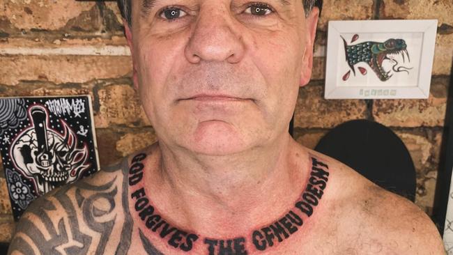 Controversial former union boss John Setka shows off his new CFMEU tattoo.