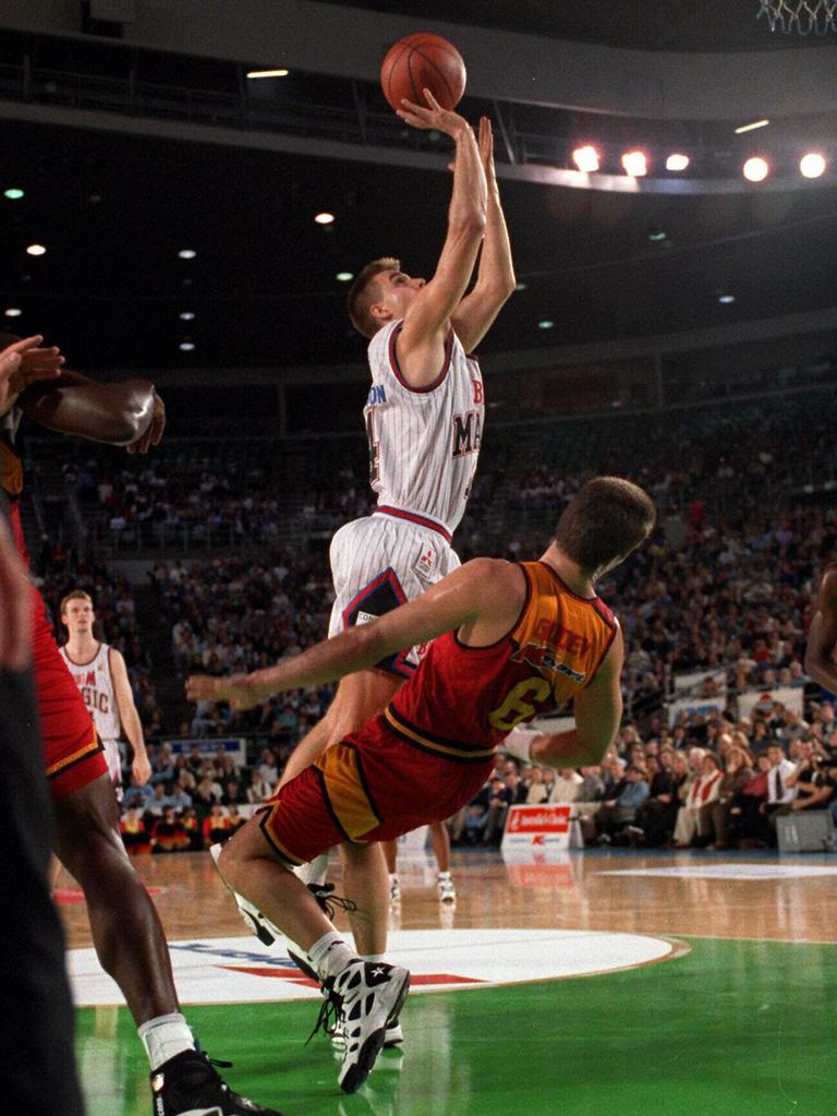 A classic Warrick Giddey pose: Putting his body on the line against former South East Melbourne Magic sharpshooter Andrew Parkinson.