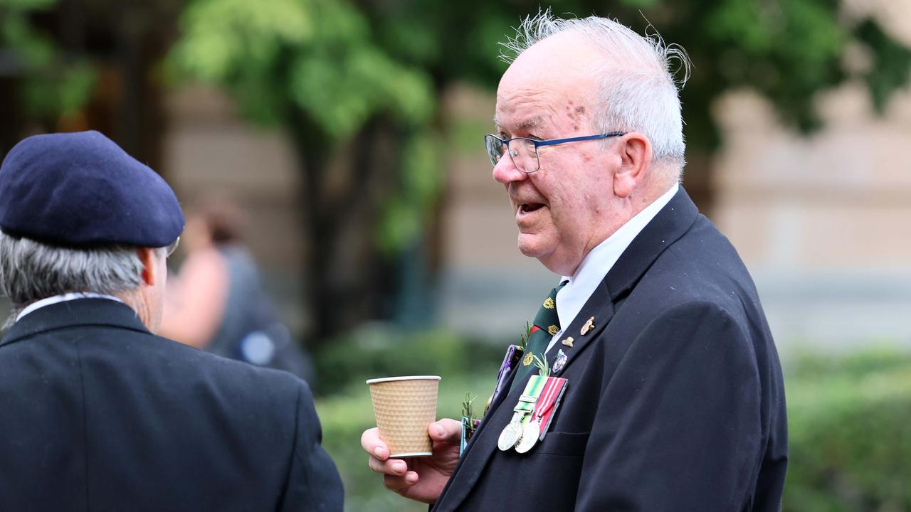 A Veteran enjoys a cup of coffee during the Anzac Day Parade held in Brisbane. Picture: NCA NewsWire/Tertius Pickard