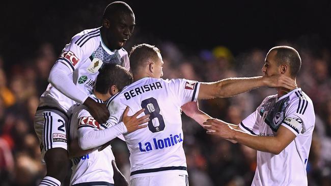 Melbourne Victory players celebrate with Marco Rojas (second left) after he scored against Bentleigh Greens in the FFA Cup on Tuesday night.