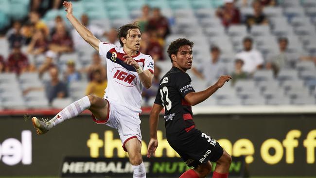 Craig Goodwin slots home the winner for Adelaide United at ANZ Stadium last night. Picture: Getty Images