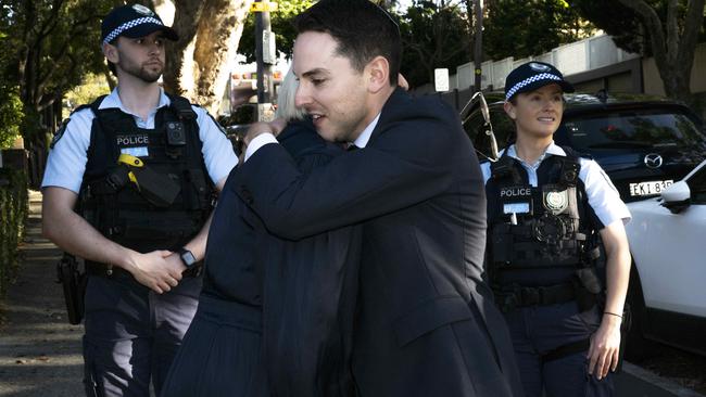 NSW Jewish Board of Deputies president David Ossip embraces Police Minister Yasmin Catley. Picture: Monique Harmer