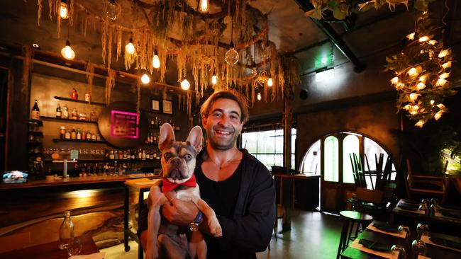 Mermaid Beach local Medi Lababi, with his dog Romeo, will be transforming what was Ally Chow into Monsieur Chow. Picture Glenn Hampson