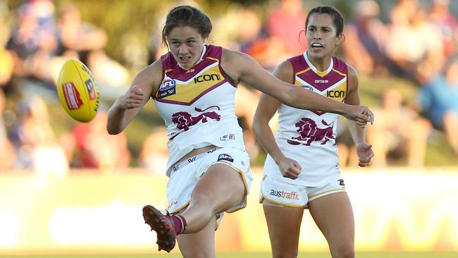 McKenzie Dowrick kicks the Lions into attack. Picture: AAP