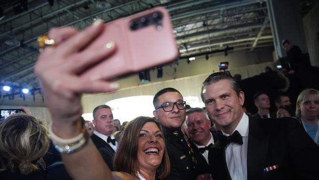 Defence secretary nominee Pete Hegseth takes a photo with guests at the Commander-in-Chief Ball in Washington, DC. Picture: Getty Images via AFP