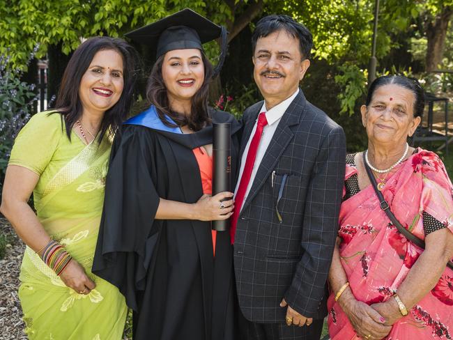 Bachelor of Nursing graduate Pritisha Adhikari with mum Punan, dad Shital and grandmother Bhuwaneshwori Adhikari at a UniSQ graduation ceremony at Empire Theatres, Tuesday, October 31, 2023. Picture: Kevin Farmer