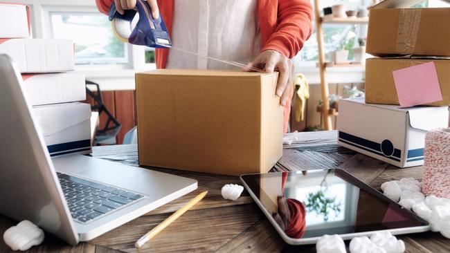 A woman selling items online to make money. Picture: iStock.