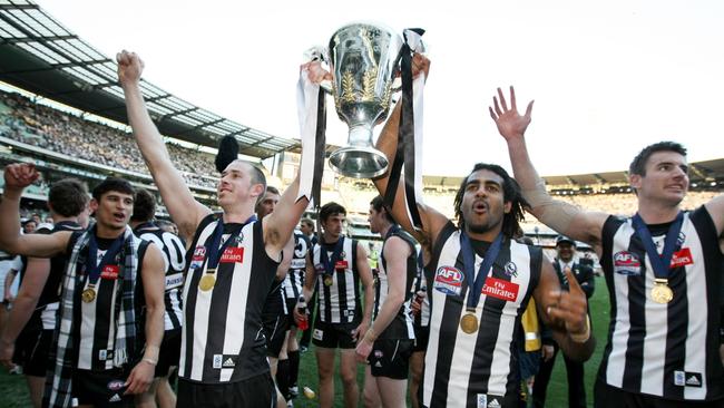 Nick Maxwell and Heritier Lumumba with the 2010 premiership cup.