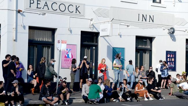 Crowds of people gather on High St in Northcote. Picture: Andrew Henshaw