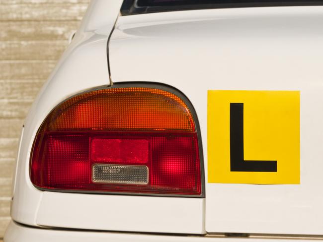 Image Of A Yellow L-Plate On White Car , Indicative Of A Learner Driver. Picture: iStock