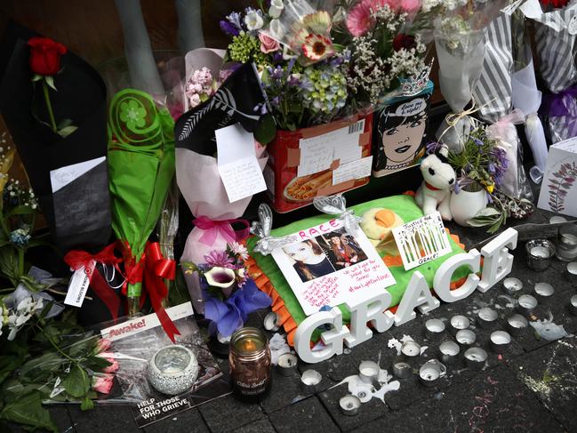 Tributes are pictured outside the CityLife Hotel on Queen Street in Auckland, New Zealand. Picture: Getty