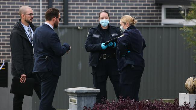 Police on the scene at a home in Carnes Hill after a man was shot during a home invasion. Picture: NewsWire