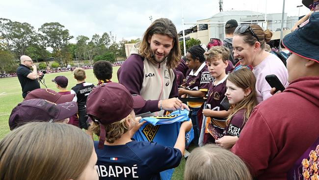 25/9/2023: Patrick Carrigan signs autographs and during selfies the fans during a Broncos fan training session at the Red Hill, Brisbane. pic: Lyndon Mechielsen/Courier Mail