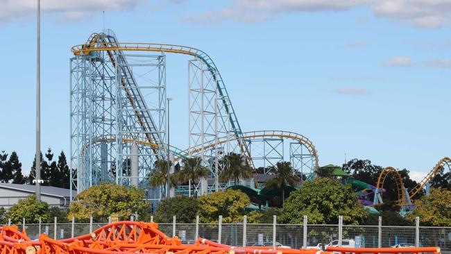 Dreamworld's gates remain closed with an unbuilt rollercoaster sitting in an empty carpark. Picture Glenn Hampson