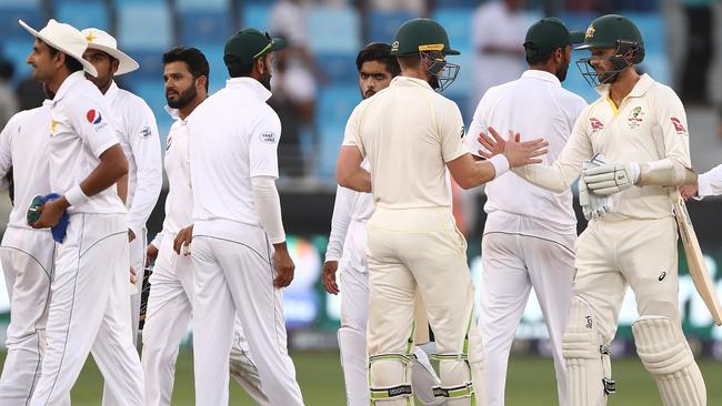 There was no over-the-top celebration for Tim Paine and Nathan Lyon. Picture: Getty.