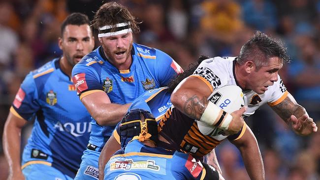 GOLD COAST, QUEENSLAND - APRIL 01: Corey Parker of the Broncos is tackled during the round five NRL match between the Gold Coast Titans and the Brisbane Broncos at Cbus Super Stadium on April 1, 2016 in Gold Coast, Australia. (Photo by Matt Roberts/Getty Images)